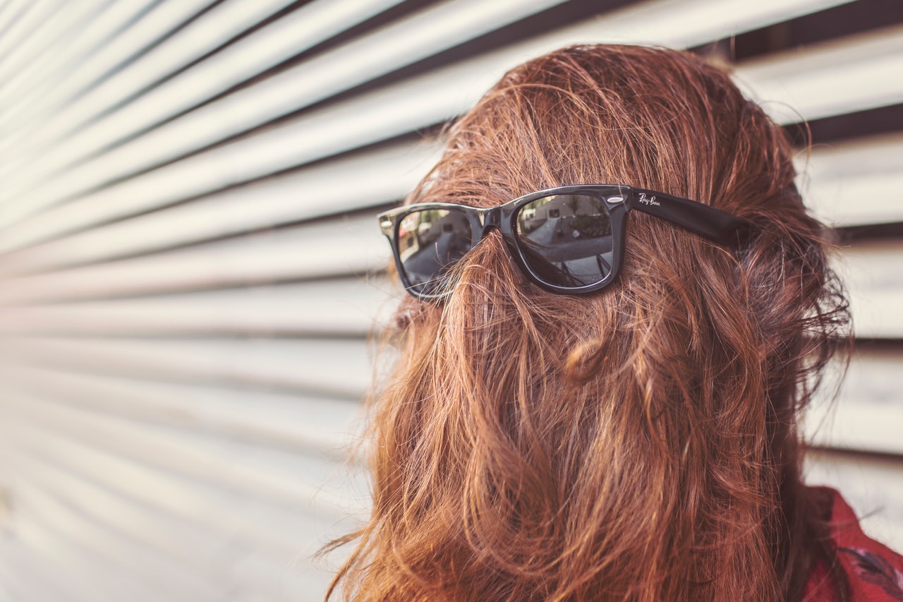 Hair-covered face with sunglasses