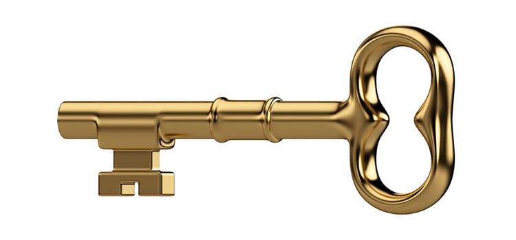 A picture of a large, antique, golden key